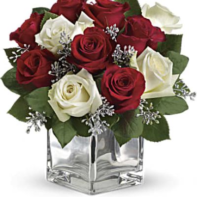 Give Christmas a charmingly contemporary spin with lush red and white roses in a dazzling mirrored silver cube. With a merrily moderate price tag, it makes the perfect gift for all the people on your list – naughty or nice.

The impressive bouquet includes red roses and white roses accented with assorted greenery.