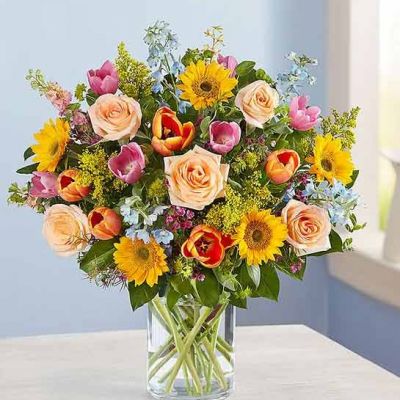 There’s so much to love about spring…but it’s the bright, beautiful blooms that make it truly sensational! Our luxurious bouquet is gathered with a garden-fresh mix in shades of pink, blue, yellow and peach. Artistically designed, this gift delivers the best part of the season right to their door.