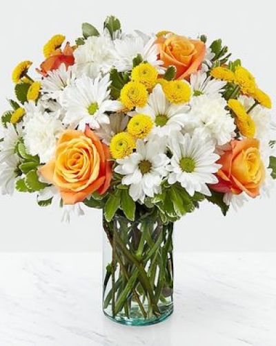 Through a collection of bold hues, gorgeous flowers, and fresh scents, this bouquet blossoms with beauty in any room that its placed. An array of orange roses, variegated pittosporum, and white daisy pompons come together in a cylindrical glass vase to make the perfect gift for a loved one near or far.

STANDARD bouquet is approx. 13H x 13W.
DELUXE bouquet is approx. 14H x 14W.
PREMIUM bouquet is approx. 15H x 15W.