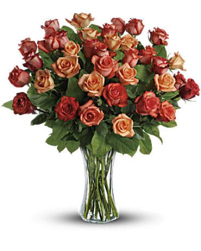 <div id="mark-2" class="m-pdp-tabs-marketing-description">The sun will come out tomorrow, and tomorrow, and tomorrow with this blazing bouquet of orange roses. Orange, light orange and dark orange - gorgeous roses delivered in a sparkling flared glass vase. No doubt about it, this is one hot gift.</div>
<p>&nbsp;</p>
<div id="desc-2">
<ul>
<li>This spectacular bouquet includes orange roses, light orange roses and dark oranges accented with salal.</li>
<li>Delivered in a flared glass vase.</li>
</ul>
</div>