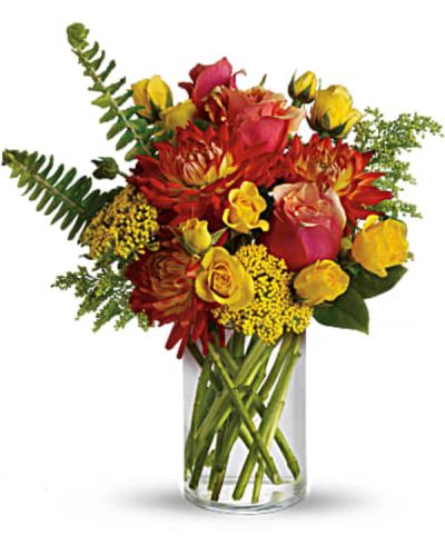 <p>As warm and inviting as falling asleep in the sun at the seaside. Bright summer flowers including orange dahlias, yellow spray roses and two-tone orange roses get a tropical twist with the addition of sword fern. Send summer someone’s way today!<br />
Orange bi-color roses, yellow spray roses and orange dahlias are mixed with yarrow, solidago, sword fern and salal in a simple cylinder vase.</p>