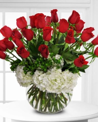 <p>From pure love to pure romance, this beautiful arrangement of red roses and white hydrangeas is set to impress.</p>