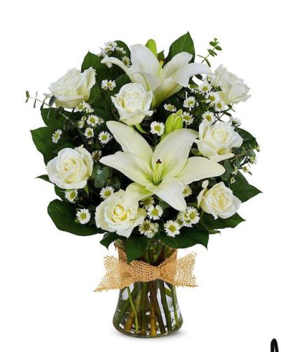 Express your feelings for loved ones with the Winter Love bouquet. Brilliant white roses, monte casino, and Asiatic lilies are hand-arranged in a clear glass gathering vase. Topped off with a decorative ribbon, this bouquet will perfectly convey your heart to your recipient.