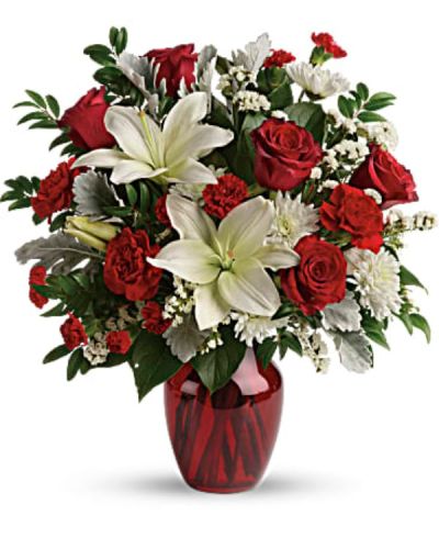 <div class="m-pdp-tabs-description">
<div id="mark-2" class="m-pdp-tabs-marketing-description">A vision of love! This luxe bouquet of fragrant white lilies and radiant red roses, hand-delivered in a ruby vase, is the perfect expression of your feelings.</div>
</div>
<p id="arrngDescp">This beloved bouquet includes red roses, white asiatic lilies, red carnations, red miniature carnations, white cushion spray roses, white sinuata statice, dusty miller, huckleberry, and lemon leaf. Delivered in a ruby rose vase.</p>