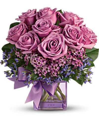 <div id="mark-1" class="m-pdp-tabs-marketing-description">Fresh as morning dew. Beautiful blooms in all shades of purple are gathered into a purple glass cube vase and tied with a purple bow. How perfectly purple!</div>
<div id="desc-1">
<ul>
<li>A pretty taffeta ribbon puts the finishing touch on this presentation of lavender roses, lavender waxflower, purple limonium and rich green salal.</li>
<li>Delivered in a glass cube vase.</li>
</ul>
</div>