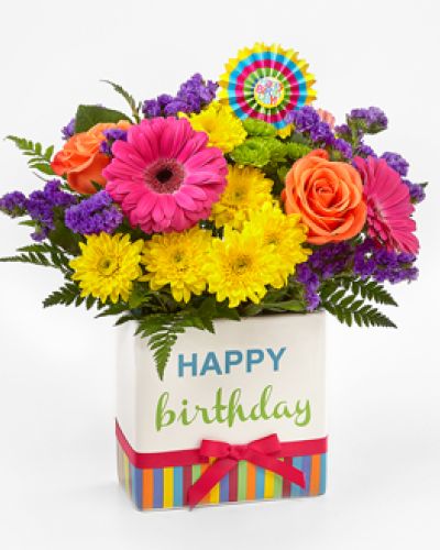 <div class="summary entry-summary">
<div class="woocommerce-product-details__short-description">
<p>The FTD® Birthday Brights™ Bouquet is a true celebration of color and life to surprise and delight your special recipient on their big day! Hot pink gerbera daisies and take center stage surrounded by purple gilly flowers, yellow chrysanthemums, orange carnations, green button poms, bupleurum, and lush greens to create party perfect birthday display. Presented in a modern rectangular ceramic vase with colorful striping at the bottom, “Happy Birthday” lettering at the top, and a bright pink bow at the center, this unforgettable fresh flower arrangement is then accented with a striped happy birthday pick to create a fun and festive gift.
</p></div>
</div>
<div class="woocommerce-tabs wc-tabs-wrapper">
<p>&nbsp;
</p></div>