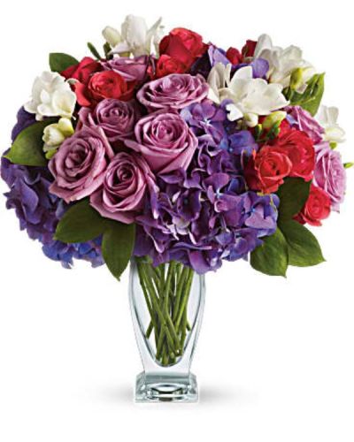 <div id="mark-3" class="m-pdp-tabs-marketing-description">She'll wax poetic over this posh purple presentation! A unique mix of colors and textures make this a stunning gift for any occasion and anyone - especially those who prefer purple!</div>
<div id="desc-3">
<ul>
<li>Rich purple roses and hydrangea are playfully contrasted with hot pink roses and fragrant white freesia in an angular glass vase.</li>
</ul>
</div>