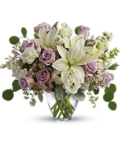 <div id="mark-2" class="m-pdp-tabs-marketing-description">Luxe in love! Pale lavender roses, creamy white lilies and delicate greens create a soft sweet bouquet that's as tender as your feelings.</div>
<div id="desc-2">
<ul>
<li>Lavender roses, white asiatic lilies, white lisianthus, white stock, lavender waxflower, and white sinuata statice are accented with dusty miller, seeded eucalyptus, and silver dollar eucalyptus.</li>
<li>Delivered in a serenity vase.</li>
</ul>
</div>